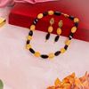 Picture of Solar Flare Necklace : Yellow Calcite with Onyx Elegance